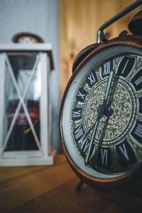 Close-up of clock on table