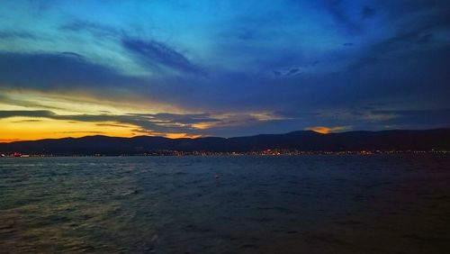 Scenic view of sea against cloudy sky