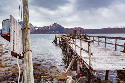 Pier over sea against sky