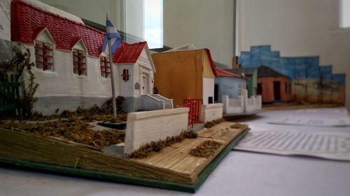 Houses on table against buildings