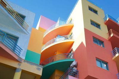 Low angle view of building against clear blue sky