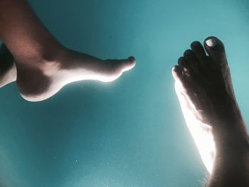 Low section of man in swimming pool