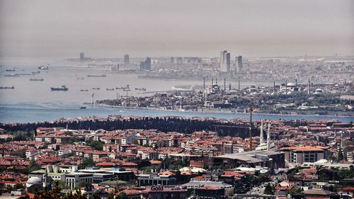 View of cityscape by sea