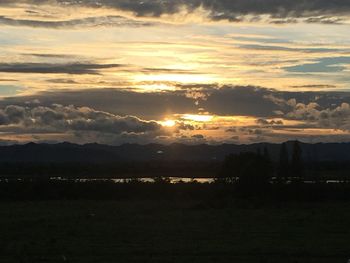 Scenic view of landscape against sky during sunset