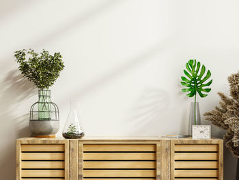 Mockup of a cabinet in a modern, empty room with a white wall.3d rendering