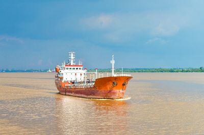 Ship in sea against sky