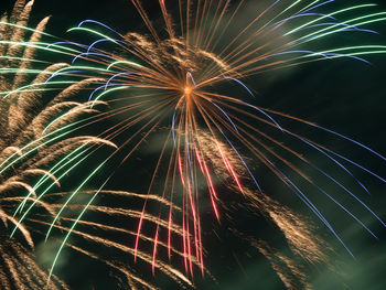 Low angle view of sky illumed with fire crackers