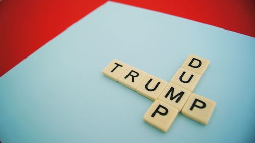 High angle view of information sign on table