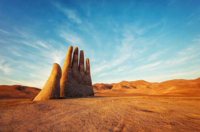 Rock formations in desert against sky