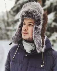Portrait of young man in snow
