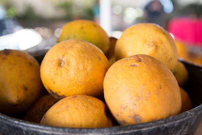 Close-up of lemons in container