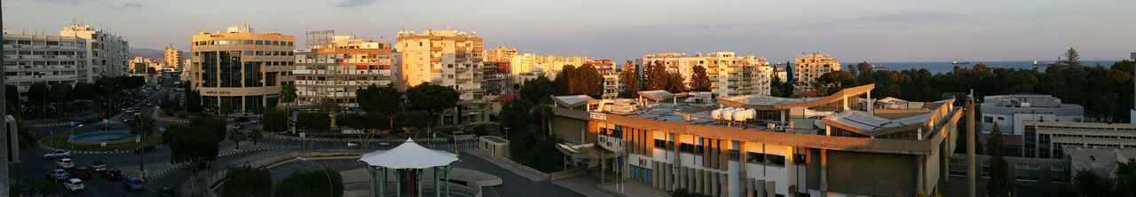 High angle view of buildings against cloudy sky