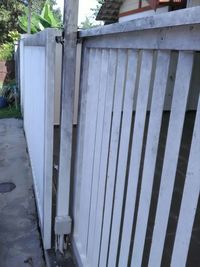 Close-up of metal fence against wall