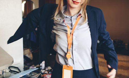 Midsection of businesswoman standing at office