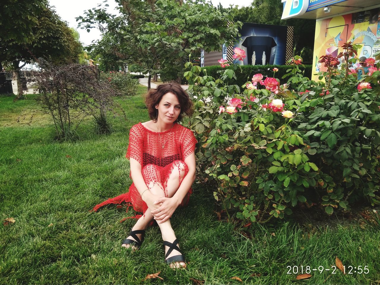 looking at camera, plant, smiling, portrait, one person, young adult, full length, happiness, front view, day, women, grass, growth, beautiful woman, leisure activity, nature, emotion, young women, adult, hairstyle, outdoors