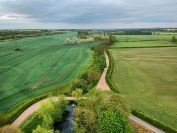 Scenic view of agricultural field against sky