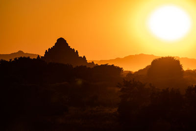 The sunset behind a mighty temple in the world heritage site of bagan in myanmar