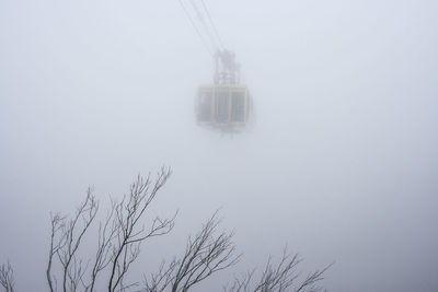 Scenic view of snow against sky during foggy weather