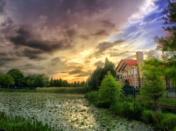 Built structure against cloudy sky at sunset