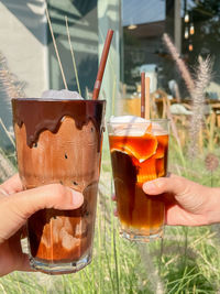 Close-up of hand holding drink