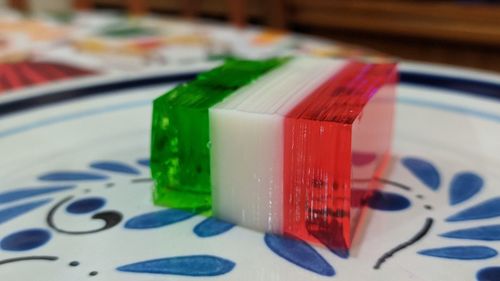 Close-up of multi colored paper on table