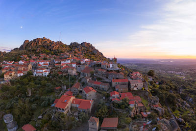 Drone aerial panorama view of monsanto historic village at sunset, in portugal