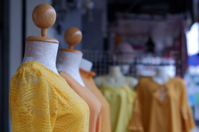 Close-up of clothes on mannequins at store