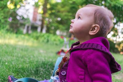 Close-up of cute baby girl outdoors