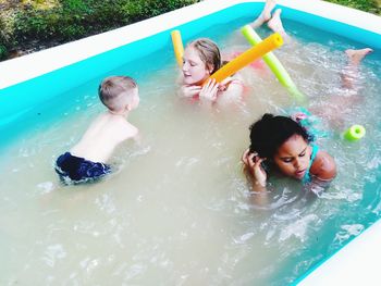 High angle view of children in swimming pool