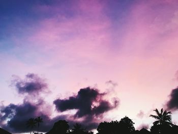 Low angle view of silhouette trees against sky during sunset