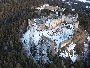 High angle view of trees and snowcapped mountains during winter