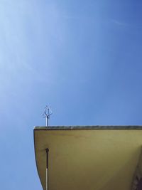 Low angle view of tree against clear blue sky