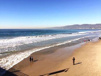 Scenic view of beach against clear sky