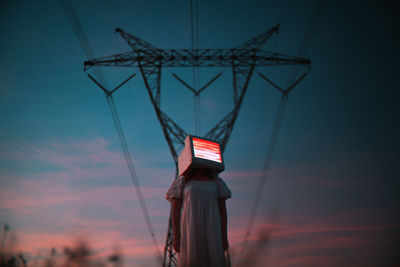 Low angle view of basketball hoop against sky during sunset