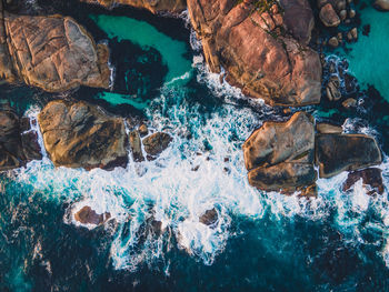 High angle view of rocks in sea