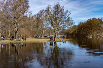 Tourists by river in forest