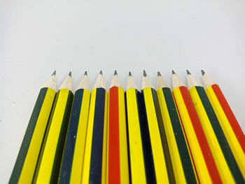 High angle view of pencils on white background