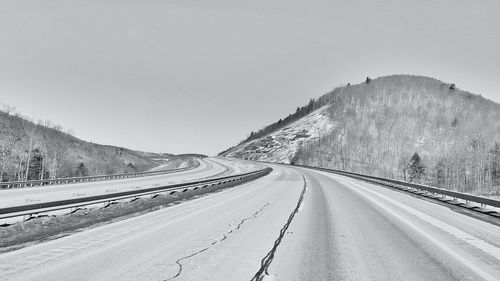 Country road leading towards mountains