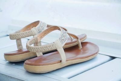 Close-up of sandals on shelf