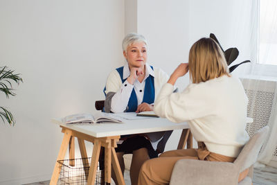 Psychologist consulting patient at clinic