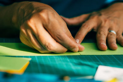 Cropped image of man working at table