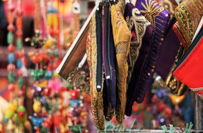 Clothes hanging at market stall for sale