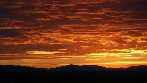 Scenic view of mountains at sunset