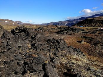 Scenic view of volcanic mountain against sky