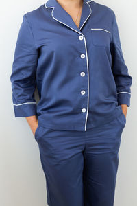 Midsection of man standing against white background