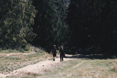 People walking in forest