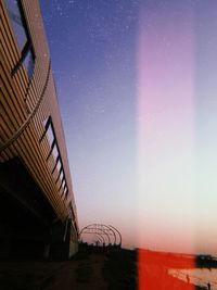 Low angle view of building against sky at night