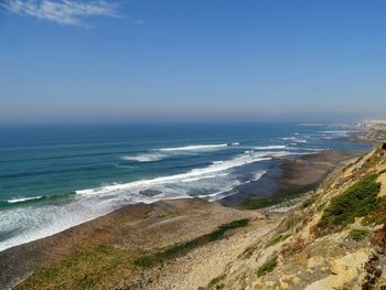 Scenic view of beach against clear sky