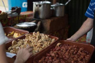 Close-up of man working in tray