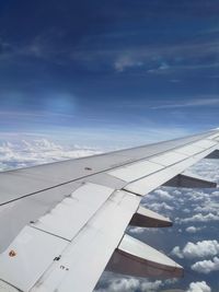 Airplane wing against sky